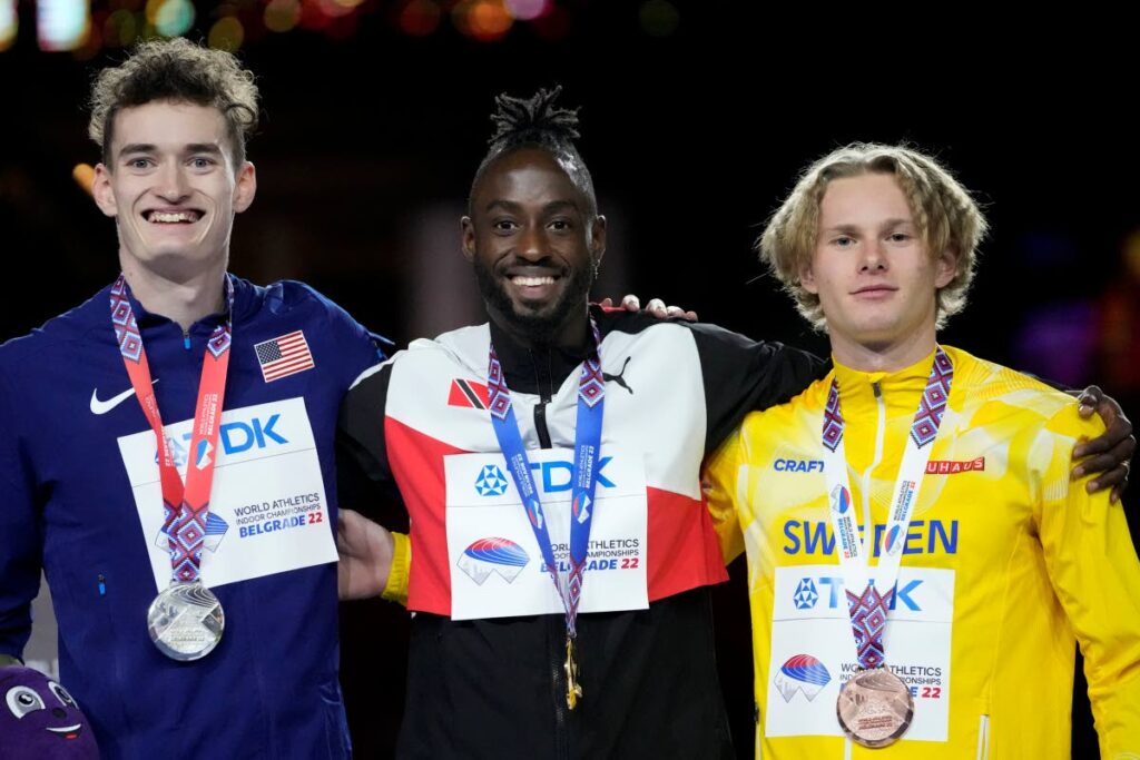 (From left to right) Silver medallist Trevor Bassitt of the United States, gold medallist Jereem Richards of Trinidad and Tobago, and bronze medallist Carl Bengtstrom of Sweden, with their medals on the podium of the men's 400 metres at the World Athletics Indoor Championships in Belgrade, Serbia, on Saturday. (AP PHOTO) -