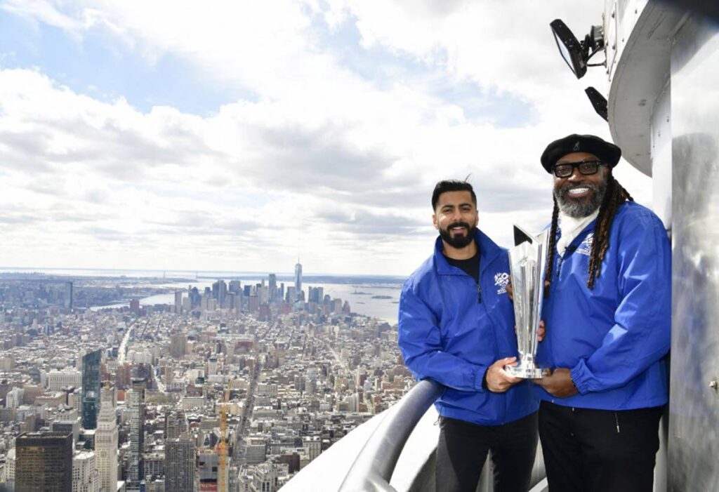 Ali Khan (L) and Chris Gayle pose for a photo during the lighting of the Empire State Building in celebration of the International Cricket Council’s T20 World Cup Trophy Tour on March 18 in New York City. - AFP PHOTO (Image obtained at newsday.co.tt)