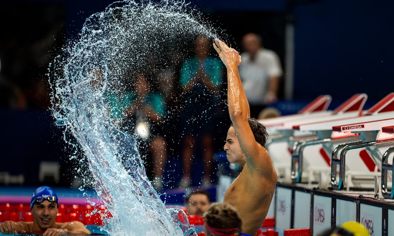 Ugo Didier of France celebrates after winning gold in the S9 400m freestyle at the 2024 Paris Paralympic Games. Photograph: Emilio Morenatti/AP (Image obtained at theguardian.com)